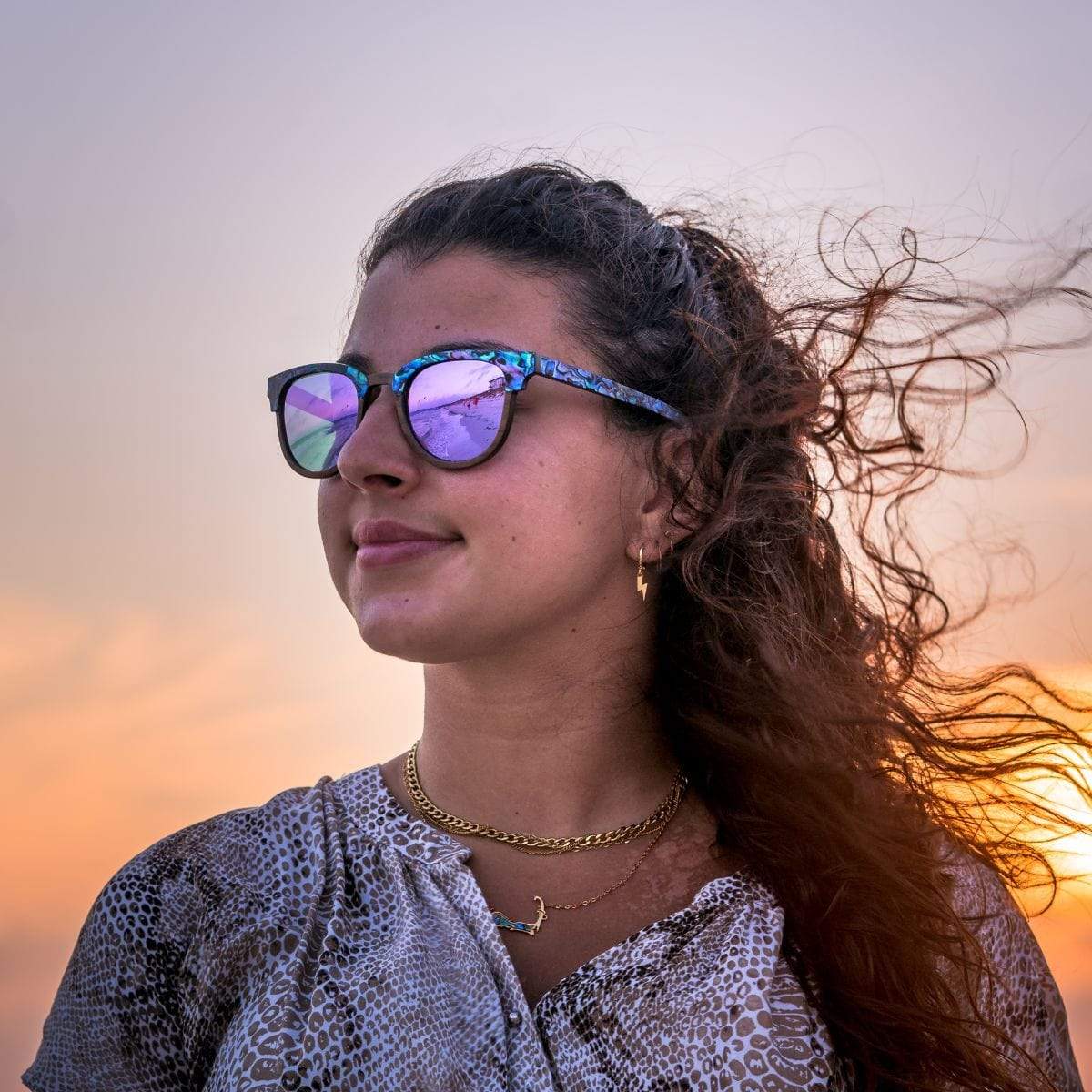 Model Wearing Wooden Beachcomber Abalone Seashell Sunglasses With Violet Lenses