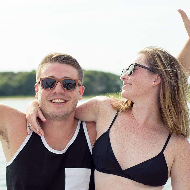 Male Model Wearing Brown Maple Wood Floating Drifter Sunglasses At The Lake