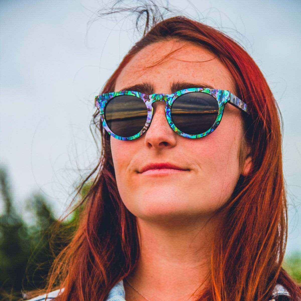 Female Model Wearing Mermaid Wooden Sunglasses With Abalone Seashell and Smoke Lenses From SLYK