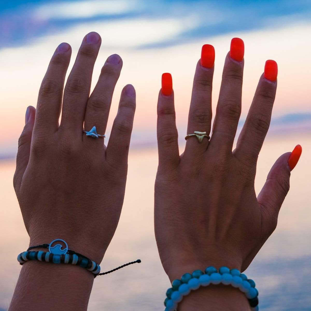 Shark Tooth Rings In Silver And Gold On Female Fingers