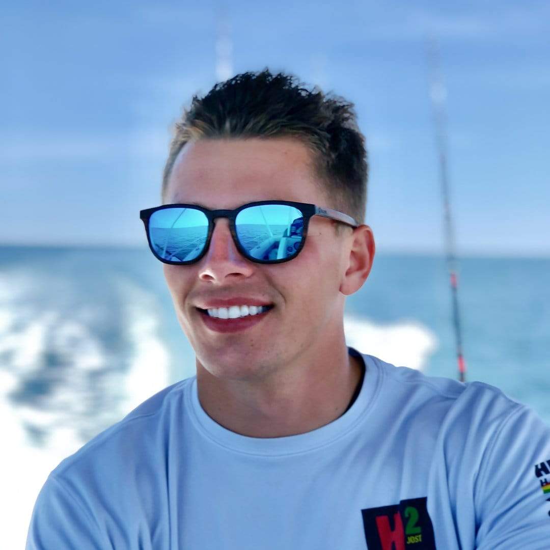 Male Model Wearing Wooden Traveler Sunglasses With Ice Blue Lenses From SLYK
