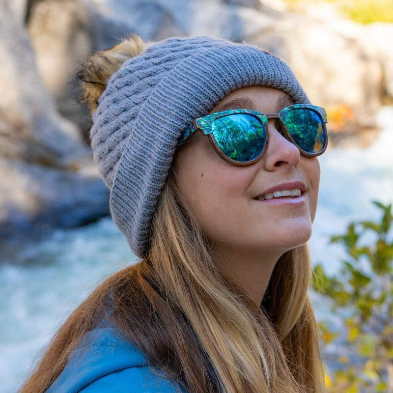 Woman Wearing SLYK Beachcomber Ice Blue Abalone Sunglasses In Winter