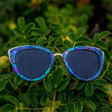 Wooden Bombshell Abalone Sunglasses With Smoke Polarized Lenses Photographed On Leaves