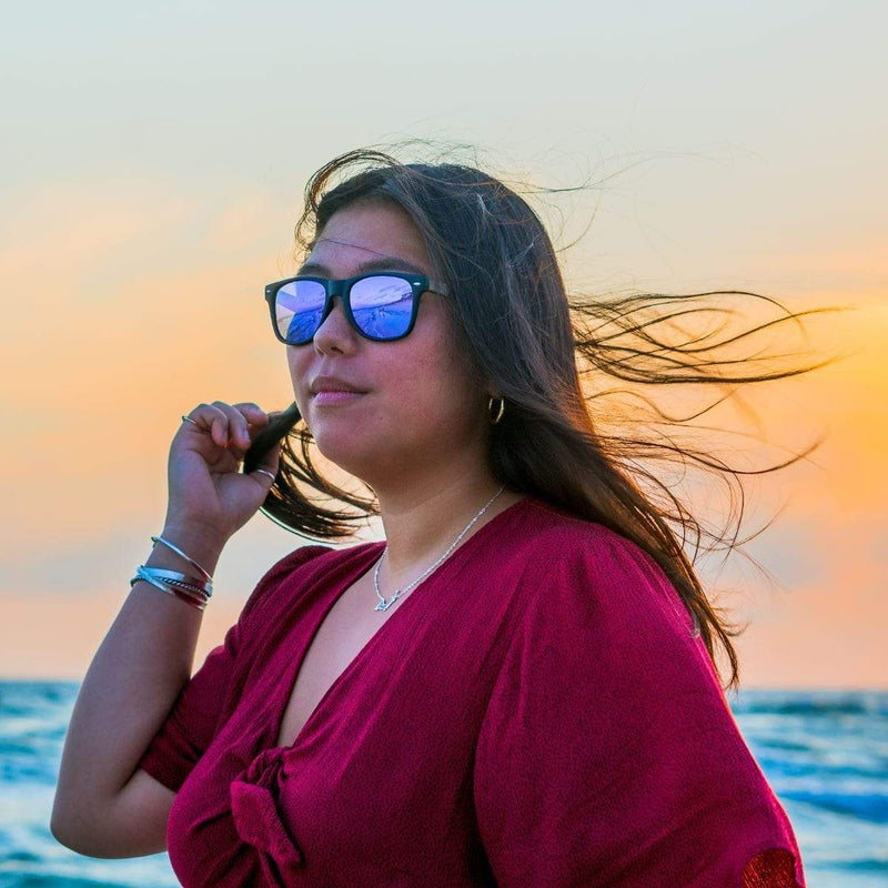 Model At The Beach Wearing Classic Wooden Sunglasses With Violet Lenses