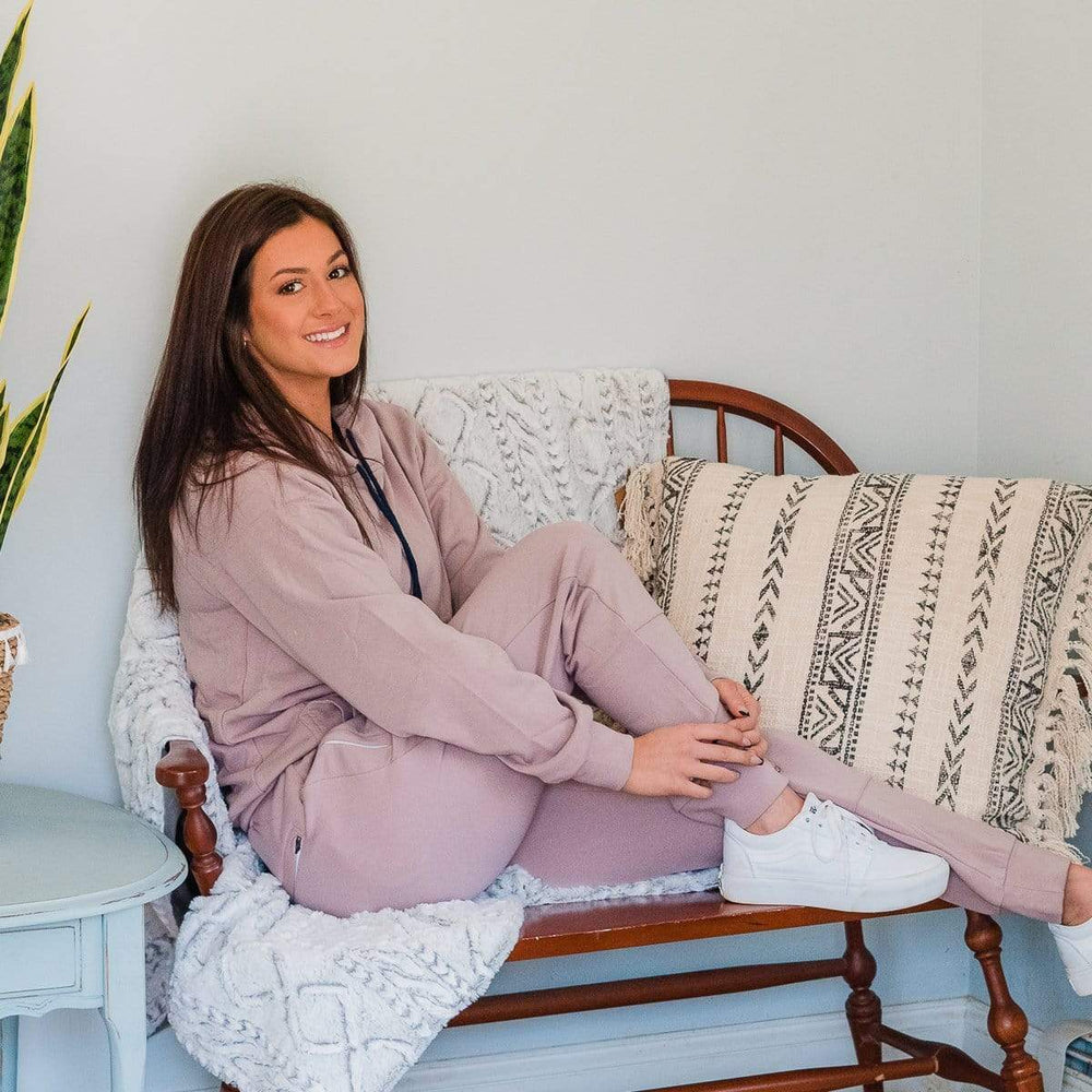 Female Model On Sofa Wearing Seagull Gray Cloud Blend Joggers From SLYK