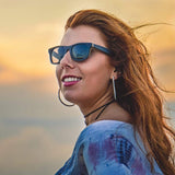 Female Model Wearing Wooden Drifter Sunglasses With Smoke Lenses That Can Float In The Water