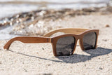 Brown Maple Wood Floating Drifter Sunglasses Photographed On The Beach