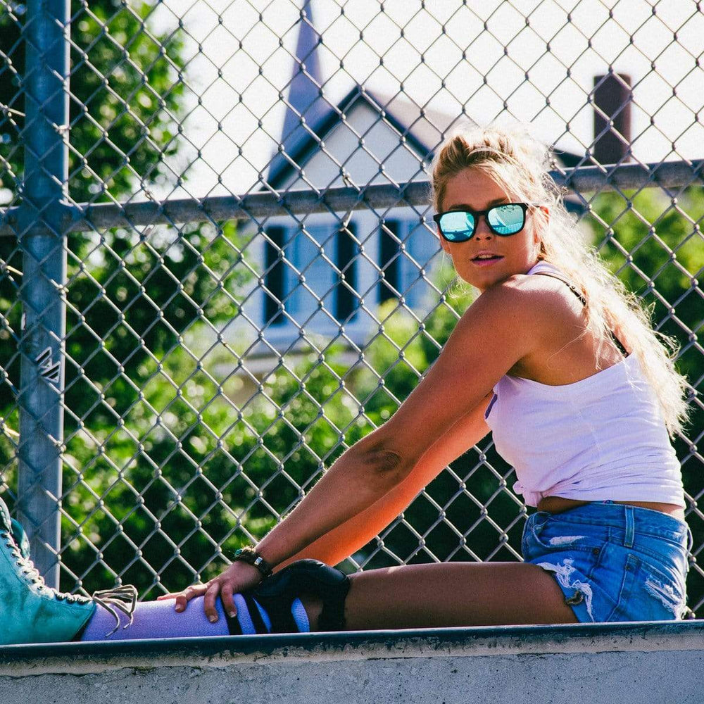 Female Model Wearing Wooden Traveler Sunglasses With Ice Blue Lenses From SLYK 